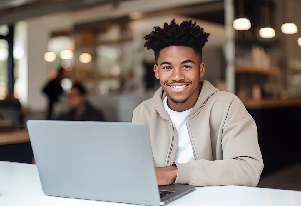 portrait-of-cheerful-black-male-student-learning-online-in_29770148